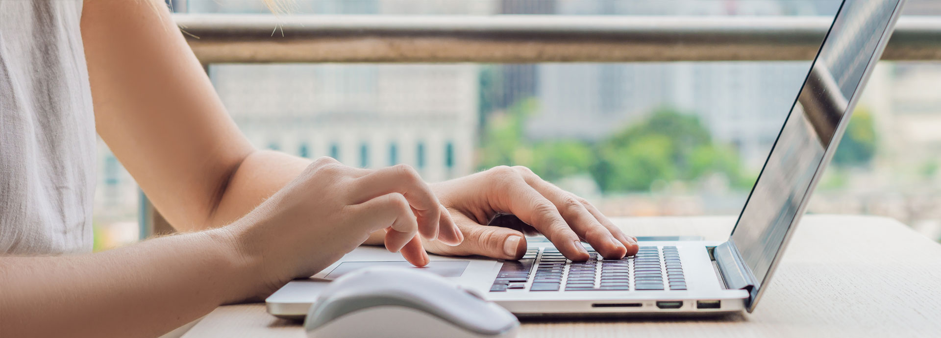 woman typing on laptop